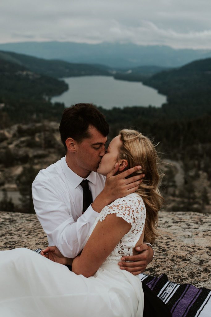 Couple Kissing over a lake Donner Lake in Northern California Near Truckee. Elopement photos in Truckee California with Northern California Elopement Photographer.