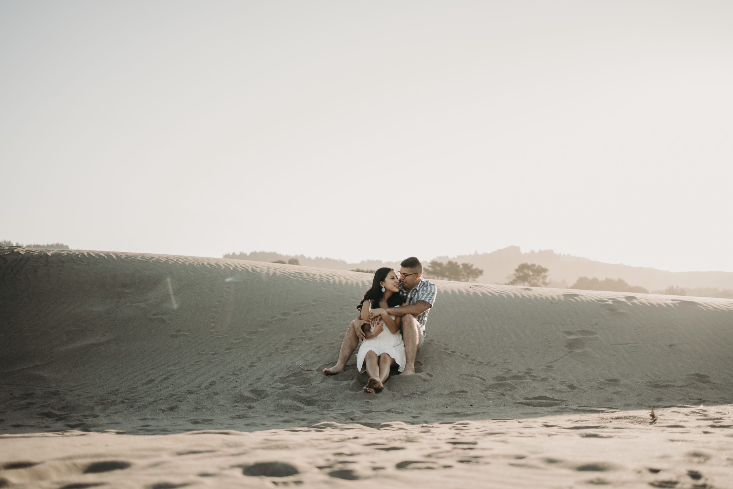 Engaged Couple Exploring Sand Dunes