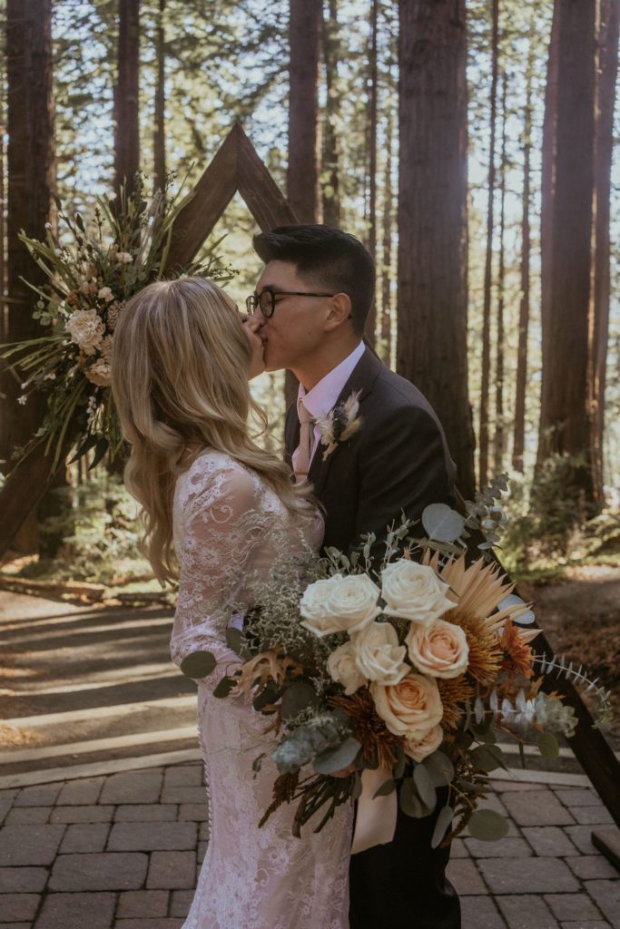 Couple Kissing in the Redwoods during their wedding Intimate Redwood Wedding photos California Wedding photography 