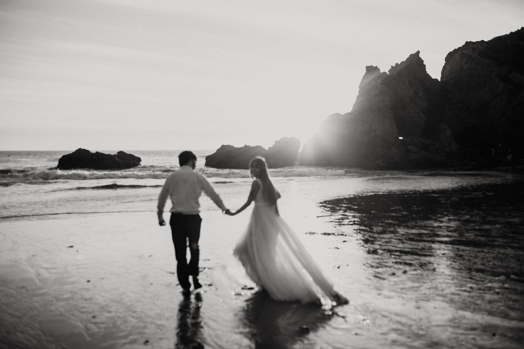 Black and White Adventure Elopement photography in Big Sur California on a Beach with a Rocky Landscape 